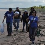 Dr. Lorena Rios Mendoza leads students in a yearly beach cleanup.