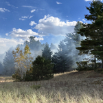 Smoke from a controlled burn floats over Minnesota Point.